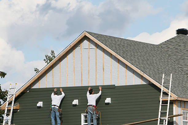 Professional Siding Installation technician working in Rockville Centre, NY